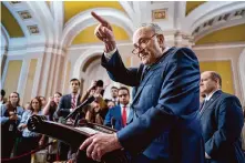  ?? J. Scott Applewhite/Associated Press ?? Senate Majority Leader Chuck Schumer, D-N.Y., shown speaking with reporters, warned in a Wednesday morning floor speech that “the survival of Ukraine is on the line.”