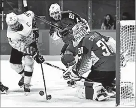  ?? RONALD MARTINEZ/GETTY ?? Jan Mursak scores the tying goal for Slovenia in its 3-2 victory over the United States.