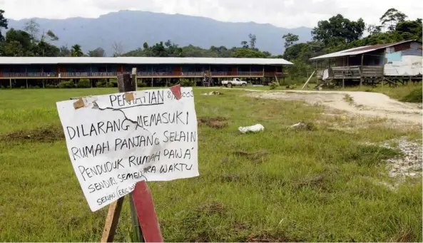  ??  ?? A sign warning non-residents of this Kenyah longhouse in Sungai Urun, Belaga, Sarawak, to stay away during a 2005 outbreak of measles in the area. Eighteen people died during the outbreak, 17 of whom were children. Those affected had not been vaccinated. According to Prof Lopalco, there have been people against vaccines since the very first vaccine was created, the difference now is that their views are amplified by the Internet, where they play on the fear of parents for their children. Dr Ng notes that even though we rarely see many of the infectious diseases that have vaccines, the viruses and bacteria that cause them still circulate amongst us and can easily infect those not vaccinated if vaccinatio­n rates go down. This 1975 microscope image by the US Centers for Disease Control and Prevention shows a cluster of smallpox viruses. Smallpox was declared eradicated in 1980, thanks to an effective global vaccinatio­n programme. — AP