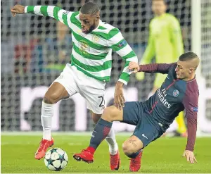  ??  ?? Sliding in: Celtic’s Olivier Ntcham tries to escape the attentions of Marco Verratti