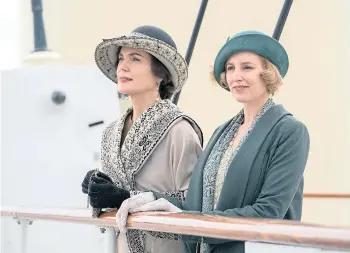  ?? ?? Elizabeth McGovern as Cora Grantham with Laura Carmichael as Lady Edith Hexham and, below, a typically elegant Downton scene.