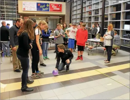  ?? CHARLES PRITCHARD - ONEIDA DAILY DISPATCH ?? Students get ready to test their vehicles and see how many feet they can go on Nov. 22017