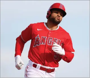  ?? STEPH CHAMBERS — GETTY IMAGES ?? Jason Martin of the Angels, circling the bases after a spring homer, has grown confident in his ability.