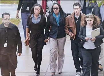  ?? Robinson Kuntz Daily Republic ?? INA ROGERS, center, walks to Solano County Superior Court, where she was taken into custody Wednesday.