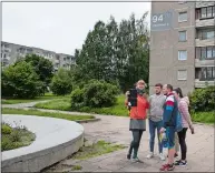  ?? MINDAUGAS KULBIS/AP PHOTO ?? A tour guide shows a group of tourists where the series “Chernobyl” was filmed in Vilnius, Lithuania.