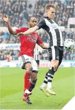  ??  ?? ■Dennis Odoi (left) and Scotland cap Matt Ritchie battle for the ball.