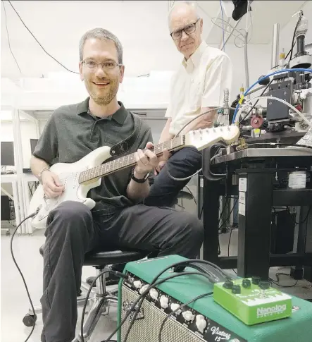  ?? DAVID BLOOM ?? Research officer Adam Bergren, left, and professor Richard McCreery’s business, Nanolog Audio, is selling their new product: a guitar pedal made with a molecular device that helps musicians obtain a warmer sound.