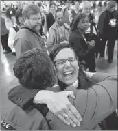  ?? RICK BOWMER/ASSOCIATED PRESS ?? The Rev. Cynthia Black, left, and the Rev. Bonnie Perry hug after Episcopali­ans overwhelmi­ngly votedWedne­sday to allow religious weddings for same-sex couples in Salt Lake City.