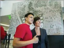  ?? RICARDO BRAZZIELL — AUSTIN AMERICAN-STATESMAN VIA AP ?? Apple employee Daniel Trevino stands with Deirdre O’Brien, Apple’s vice president of people, after an announceme­nt about Apple’s new campus Thursday in Austin, Texas.