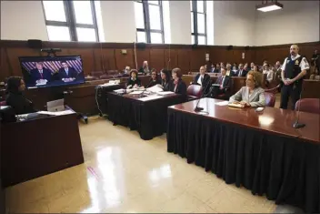  ?? CURTIS MEANS VIA POOL — THE ASSOCIATED PRESS ?? Former president Donald Trump, left on screen, and his attorney, Todd Blanche, right on screen, appear by video, as his other attorney Susan Necheles, right, looks on, before a hearing begins in Manhattan criminal court, in New York, Tuesday, May 23, 2023. Trump made a video appearance Tuesday in his New York criminal case, with the judge tentativel­y setting a trial date for late March of next year.