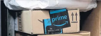  ?? MARK LENNIHAN THE ASSOCIATED PRESS FILE PHOTO ?? Amazon’s costly efforts to expand on the streets and in the air is enabling the e-commerce giant to control how goods reach its customers and increasing­ly turning it from a customer of delivery companies into a rival.