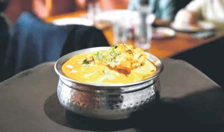  ?? — AFP photo ?? A butter chicken dish served at the Moti Mahal restaurant in New Delhi.