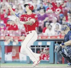  ?? Joe Robbins / Getty Images ?? Relief pitcher Michael Lorenzen of the Reds hits a grand slam against Milwaukee. He’s homered in his past three at-bats.