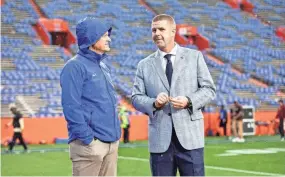  ?? ?? Florida athletic director Scott Stricklin talks with Gators head coach Billy Napier during Gator Walk at Steve Spurrier Field at Ben Hill Griffin Stadium on Nov. 25 in Gainesvill­e.