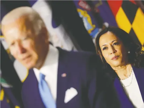  ?? CARLOS BARRIA/REUTERS ?? Democratic Senator Kamala Harris looks on as Democratic presidenti­al nominee and former vice-president Joe Biden speaks at their first joint appearance since Biden named Harris as his running mate.