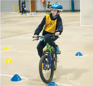  ??  ?? Above: - Bona Vista Primary School student Arielle Eades negotiates her way around the course
Left and right: Bona Vista Primary School student Cameron Eades negotiates the figure of eight section