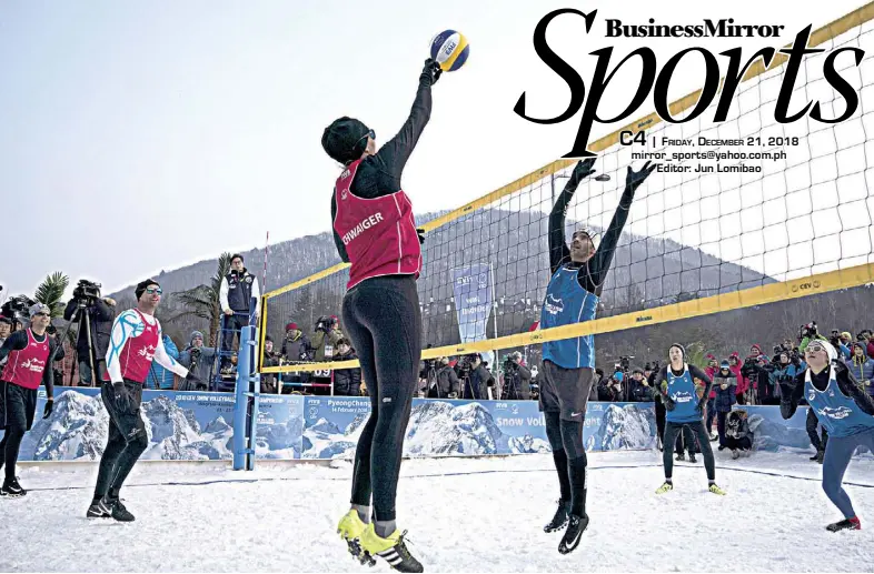  ??  ?? BRAZIL’S Giba (center) tries to block Austria’s Stefanie Schwaiger during a snow volleyball exhibition match at the Austria House in Pyeongchan­g, South Korea, in February. AP