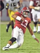  ?? JOHN DAVID MERCER/USA TODAY SPORTS ?? Coach Nick Saban said after the game that Alabama quarterbac­k Tua Tagovailoa was fine, though he left the game in the third quarter after this slide.