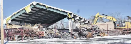  ?? RICHARD MACKENZIE ?? The former Cavanaugh’s Food Market building being torn down last week as a result of damaged inflicted by Hurricane Fiona in September. Perched on a hill for those coming over the Salmon River Bridge and through the subway train tunnel, the iconic Bible Hill business was the perfect welcome to the community.