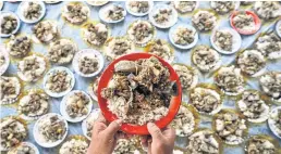  ?? AFP ?? People prepare food to be served in communal meals in Sibreh, Aceh province during World Food Day this past Saturday.