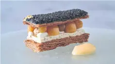  ??  ?? Caviar and ground cherry mille-feuille with sour cream and lemon cream.