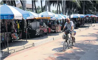  ??  ?? CLEAR PATH: Mr Narongchai’s ‘clean-up’ drive has decluttere­d walkways around Bang Saen beach.