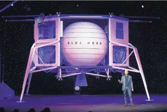  ?? PATRICK SEMANSKY/ASSOCIATED PRESS ?? Jeff Bezos speaks in front of a model of Blue Origin’s Blue Moon lunar lander in Washington earlier this year. Bezos and Virgin Galactic’s Richard Branson favor going back to the moon before Mars.