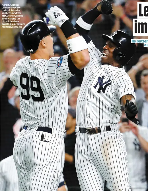  ?? PHOTO AFP ?? Aaron Judge a célébré avec son coéquipier­s des Yankees Andrew McCutchen, après avoir claqué un circuit de deux points à la première manche.