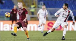  ??  ?? ROME: Roma’s Radja Nainggolan, left, vies for the ball with Cagliari’s Marco Borriello during a Serie A soccer match between Roma and Cagliari, at the Olympic stadium, in Rome, Sunday. —AP