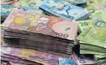  ?? PHOTO: ?? Cash is king . . . among children and the elderly at least, a Reserve Bank study has found. ODT FILES