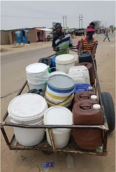  ??  ?? The couple, Onias and Anesu, make about four trips per day fetching water beginning their day normally at 8am and finishing around 4pm