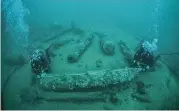  ?? NORFOLK HISTORIC SHIPWRECKS VIA AP ?? Julian And Lincoln Barnwell measure the cannon found on the HMS Gloucester in 2007. Excavators and historians are telling the world about the wreck of a royal warship that sank in 1682.