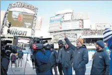  ?? ADAM HUNGER/AP PHOTO ?? Troy Terry waves to the crowd as the roster for the men’s USA Olympic hockey team is announced at the NHL Winter Classic on Monday at Citi Field in New York.