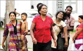  ?? AP ?? Relatives of a blast victim grieve outside a morgue in Colombo, Sri Lanka, Sunday