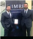  ??  ?? NSRI Plettenber­g Bay station commander Marc Rodgers and coxswain Robbie Gibson attended the Internatio­nal Maritime Rescue Federation Awards in London and were awarded second place in the Innovation and Technology category for their stretcher.