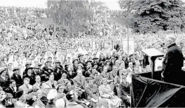  ?? ?? A vast congregati­on of Roman Catholics in the Dane John in September 1955 in honour of St Thomas More, where the preacher was the Very Rev W.harty, of New Orleans, USA