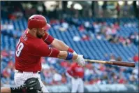  ?? The Associated Press ?? HOME-RUN DERBY: Philadelph­ia’s Cameron Rupp follows through after hitting a solo home run off Miami’s Dan Strally during the first game of a doublehead­er Tuesday. The teams combined for nine home runs, the visiting Marlins winning 12-8.