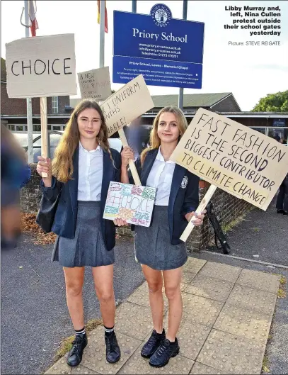  ?? Picture: STEVE REIGATE ?? Libby Murray and, left, Nina Cullen protest outside their school gates yesterday