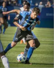  ?? PETER MCCABE — THE ASSOCIATED PRESS ?? Philadelph­ia Union’s Warren Creavalle, back, battles with Montreal Impact’s Alejandro Silva as they vie for possession of the the ball during second-half MLS soccer game action in Montreal, Saturday.
