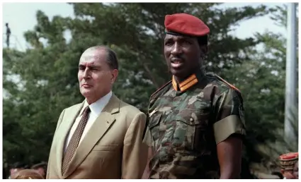  ?? ?? ‘Colonisers transforme­d themselves into “technical assistance”. We should say “technical assassins”’ … Thomas Sankara, president of Burkina Faso, with French president François Mitterrand in 1986. Photograph: Daniel Janin/AFP via Getty Images