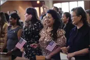  ?? ERIC GAY — THE ASSOCIATED PRESS FILE ?? Women representi­ng more than 20countrie­s take part in a Naturaliza­tion Ceremony, March 8in San Antonio.