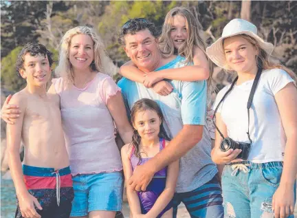  ?? Picture: Nathan ?? The Hinks family (from left) Sam, Steph, Adam, Erin, Melia and Abbie (front) on Magnetic Island. Steph and Adam won the Richard Power Award for Outstandin­g Contributi­on by an Individual at the 2021 North Queensland Tourism and Events Awards. Mcneil