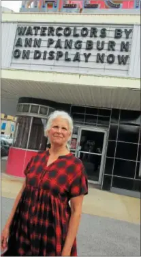  ??  ?? Ann Pangburn stands under the marquee of the Kallet Civic Center in Oneida on Aug. 11.