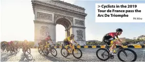  ?? PA Wire ?? Cyclists in the 2019 Tour de France pass the Arc De Triomphe