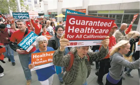  ?? Rich Pedroncell­i / Associated Press ?? Supporters of a single-payer health care system march to the state Capitol in April. SB562 by state Sens. Ricardo Lara, D-Bell Gardens (Los Angeles County), and Toni Atkins, D-San Diego, would create a plan to cover the state’s 39 million residents.