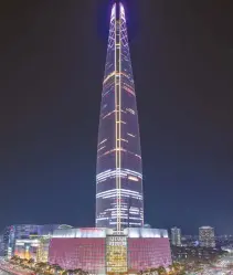  ?? Courtesy Lotte Corp. ?? Pink lights illuminate Lotte World Tower in Seoul, Thursday. Lotte Corp. is holding a Pink Ribbon campaign to raise public awareness about breast cancer. The 123-story tower will be lit up in pink from 7 p.m. to 10 p.m. today.