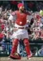  ?? JEFF ROBERSON — THE ASSOCIATED PRESS ?? St. Louis Cardinals catcher Yadier Molina stands with his hands on his hips as a ball is somehow stuck to his chest protector during the seventh inning of a baseball game against the Chicago Cubs on Thursday in St. Louis.