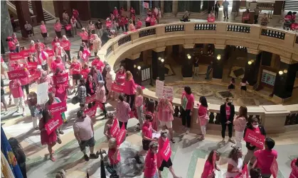  ?? Photograph: Harm Venhuizen/AP ?? Abortion rights supporters gather for a ‘pink out’ protest organized by Planned Parenthood in the rotunda of the Wisconsin capitol.