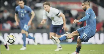  ??  ?? Lorenzo Insigne hits home Italy’s late penalty equaliser to ensure a 1-1 Wembley draw against England.