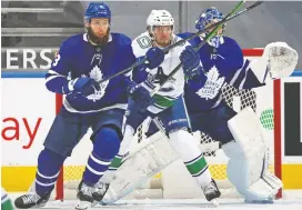  ?? CLAUS ANDERSEN/GETTY IMAGES ?? The Toronto Maple Leafs expect to have defenceman Jake Muzzin, left, back in the lineup for their trip to Edmonton to face the streaking Oilers.